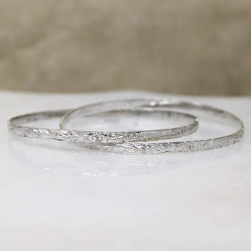 Two Slim Sterling Bangles with Hawaiian Pua Kala Flowers