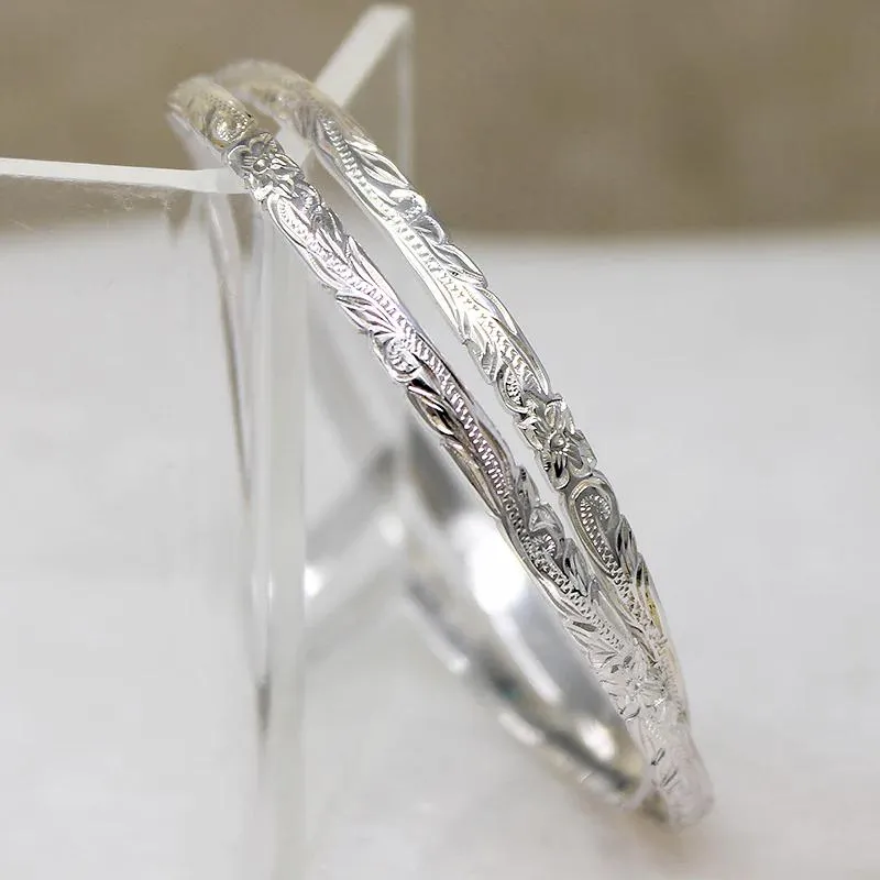 Two Slim Sterling Bangles with Hawaiian Pua Kala Flowers